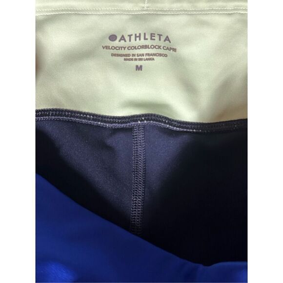 Women's Athleta Velocity Black Blue Color Block Stash Pocket Capri leggings Gym - Picture 7 of 7